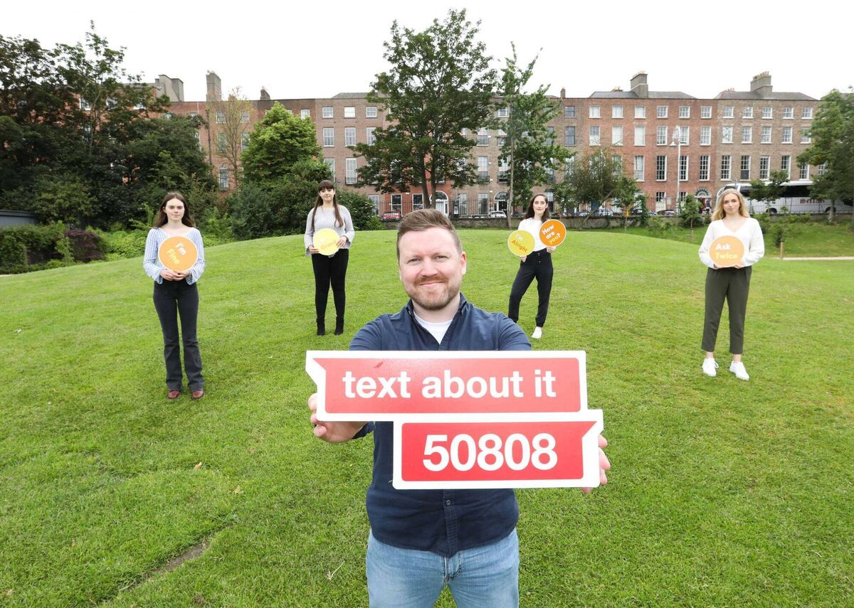 Pictured today in Merrion Square, Dublin, is CEO of 50808 Ian Power with text centre volunteers. Photograph: Sasko Lazarov / Photocall Ireland Pictured today in Merrion Square, Dublin, is CEO of 50808 Ian Power with text centre volunteers. Photograph: Sasko Lazarov / Photocall Ireland