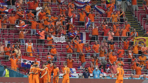 <p>Memphis Depay, covered by his teammates, of the Netherlands celebrates after scoring his side's opening goal. Picture: AP Photo/Peter Dejong</p>