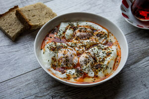 Poached eggs with yoghurt, paprika and mint