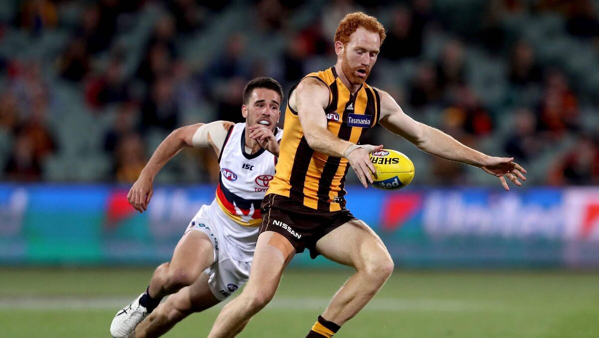 Lachlan Murphy of the Crows tackles Conor Glass of the Hawks during the 2020 AFL Round 15 match between the Hawthorn Hawks and the Adelaide Crows. Picture: Getty Images