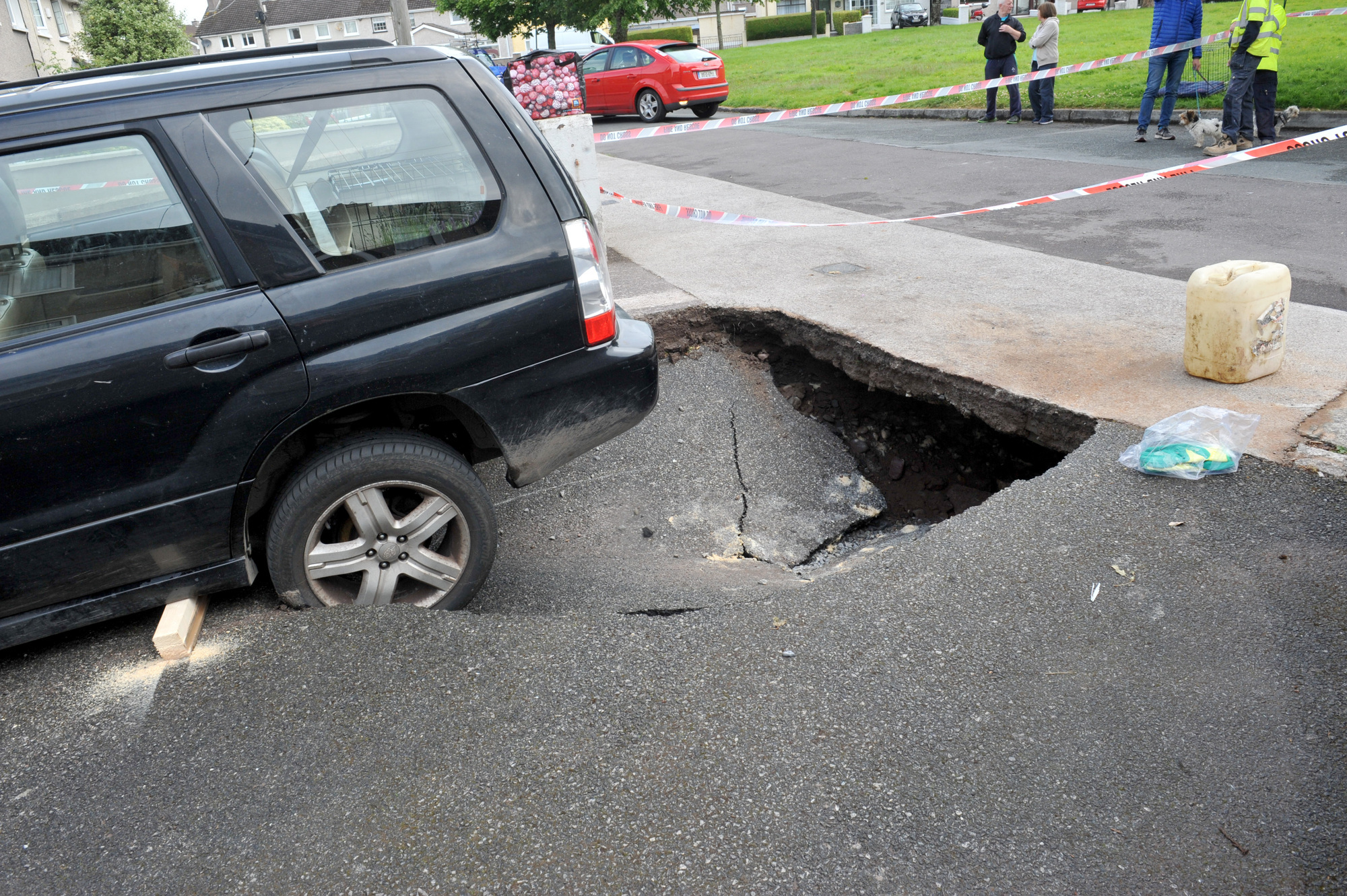 WATCH: Cork family forced to evacuate home as water leak leaves sinkhole in driveway