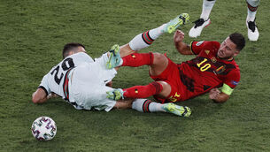 <p>Portugal's Joao Cancelo, left, competes for the ball with Belgium's Eden Hazard at La Cartuja stadium in Seville. (Jose Manuel Vidal/Pool via AP)</p>