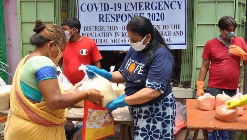 The Hope Foundation distributing food packs and offering medical support to communities in Kolkata, India. Pictured here is the late Geeta Venkadakrishnan, director of the Hope Foundation. Picture: Hope Foundation/Twitter
