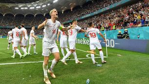 <p>Granit Xhaka of Switzerland celebrates their side's third goal scored by team-mate Mario Gavranovic. (Photo by Justin Setterfield/Getty Images)</p>