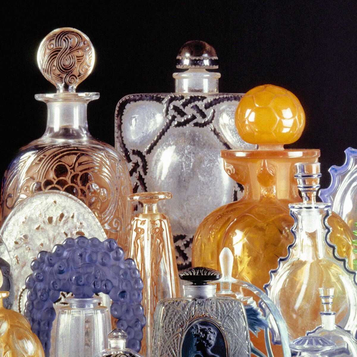 Ensure you arrange your fine glass, like this display of Lalique with room to breathe. Simply taking them out of a tight arranged position can lead to damage, lalique.fr.