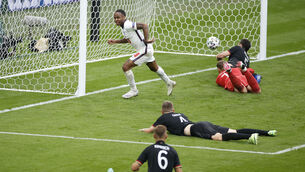 <p>England's Raheem Sterling celebrates after scoring his side's opening goal at Wembley. (John Sibley/Pool via AP)</p>