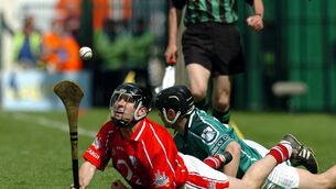 <p>Cork's Ben O'Connor on the ground with TJ Ryan of Limerick during their 2004 clash. Picture: Gerard McCarthy</p>