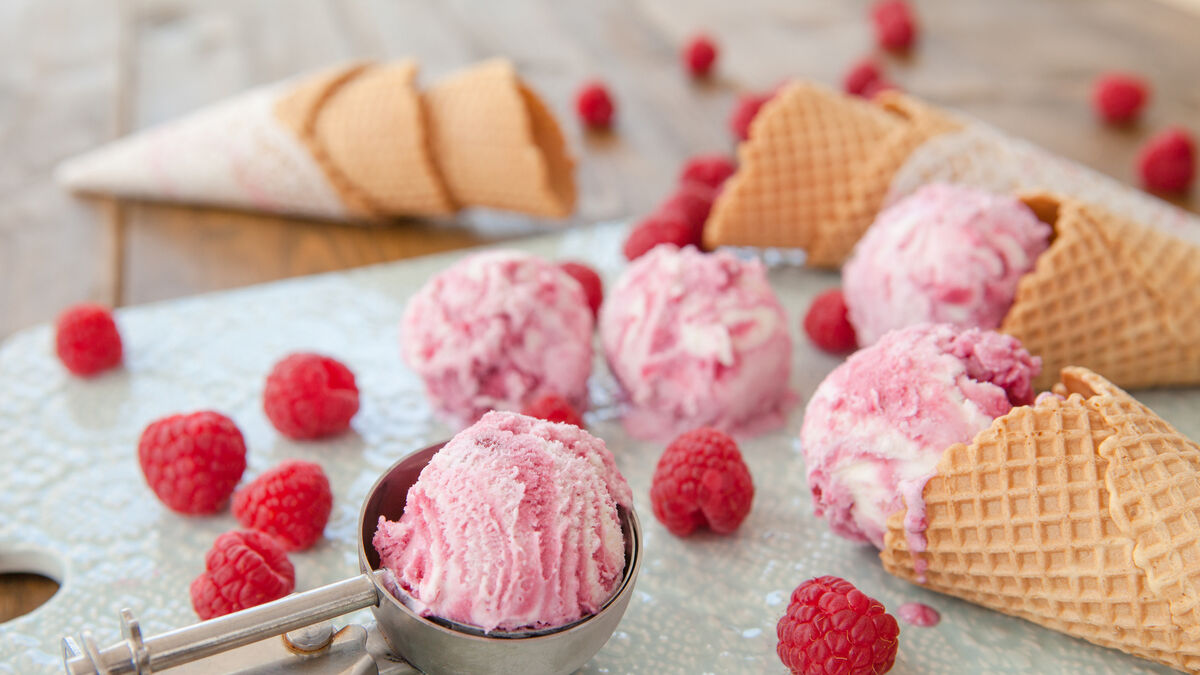 Raspberry ice cream with fresh raspberry sauce