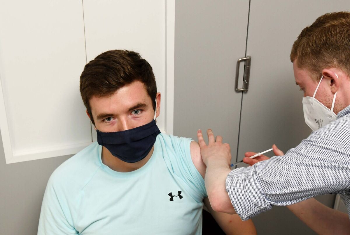 Darren Neville, 25, Ballintemple, Cork, delighted to be getting his Covid-19 vaccine from pharmacist Chris Moran at Phelans Pharmacy, Blackrock Hall, Cork.