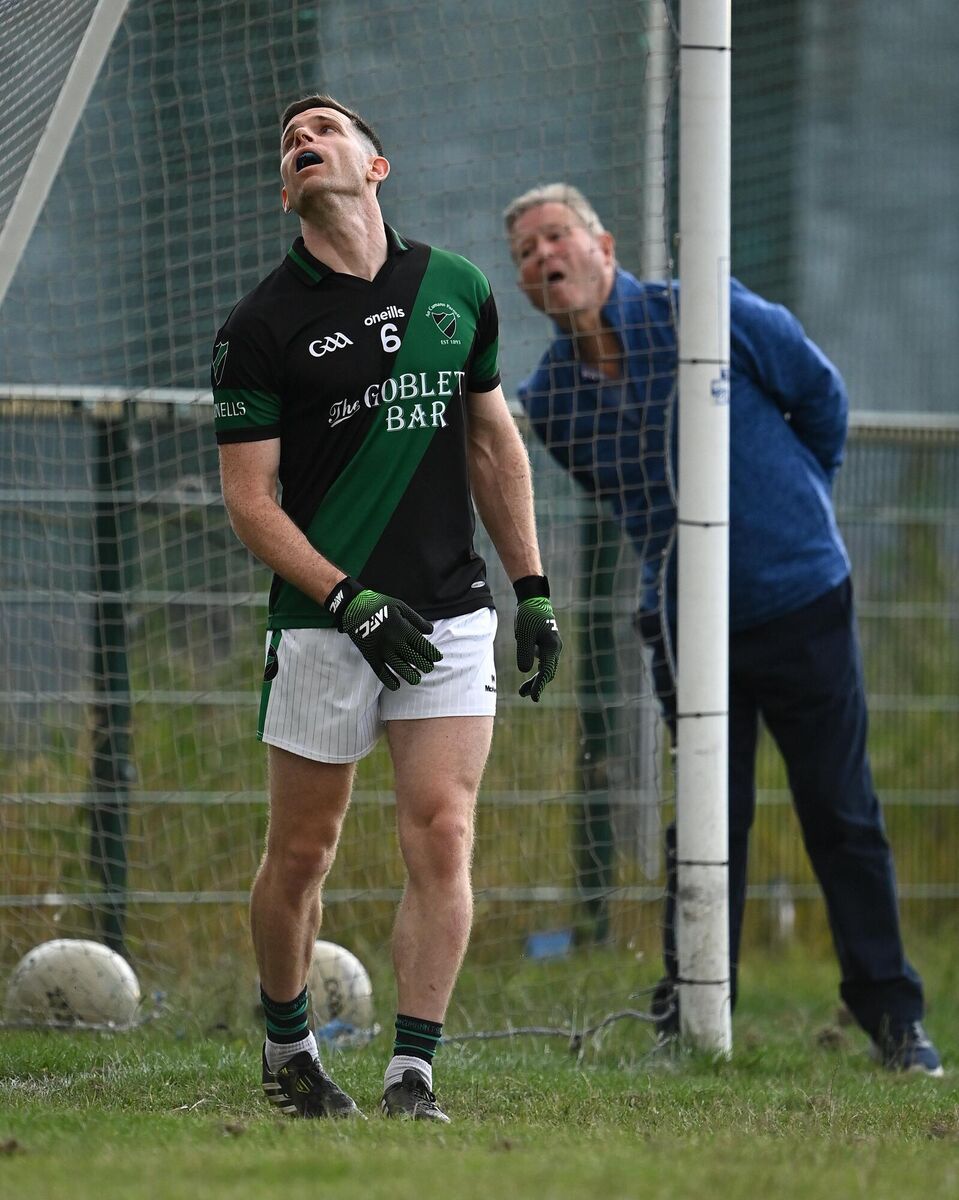 Stephen Cluxton looks on, alongside umpire Martin Flanagan, at Parnells GAA Club in Coolock, Dublin. Photo by Piaras Ó Mídheach/Sportsfile