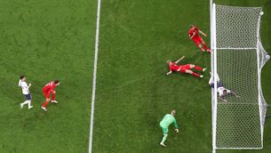 <p>Simon Kjaer of Denmark scores an own goal, England's first, while under pressure from Raheem Sterling of England at Wembley Stadium. (Photo by Laurence Griffiths/Getty Images)</p>