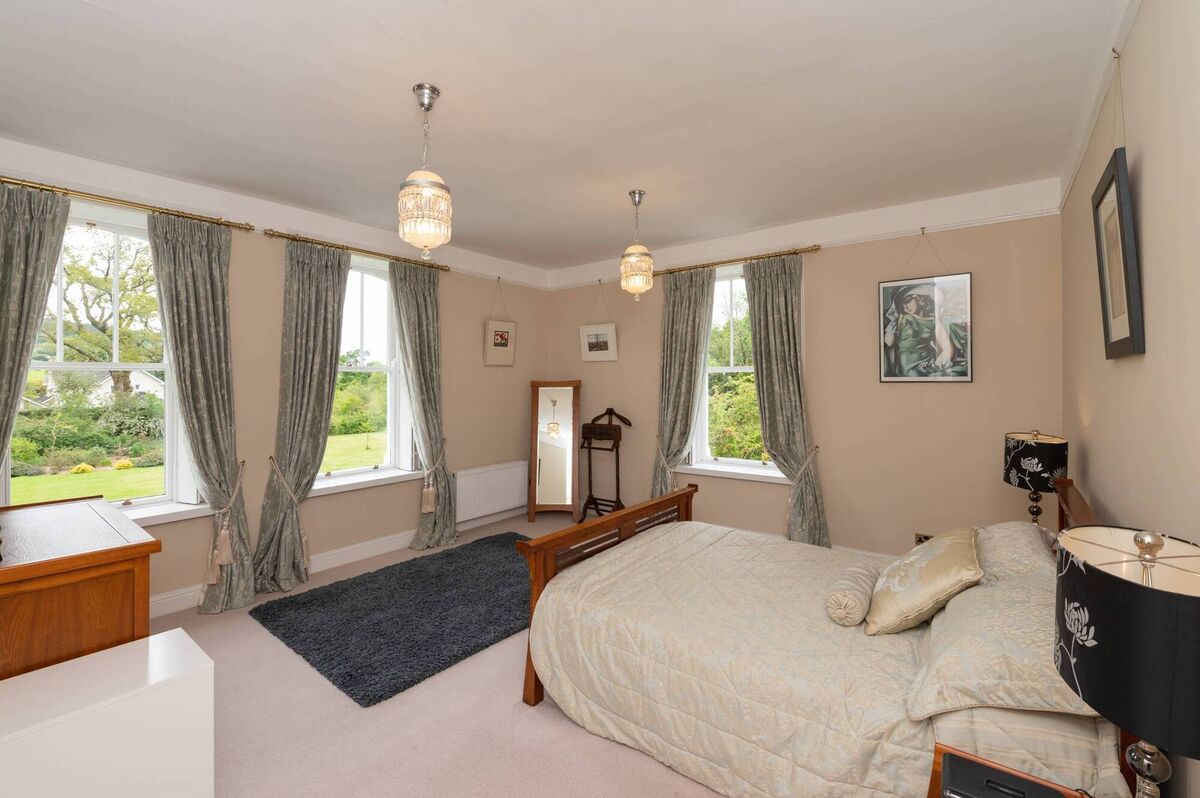 Double aspect main bedroom has a dressing room alongside
