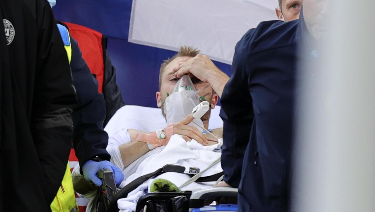 Paramedics using a stretcher to take out of the pitch Christian Eriksen after he collapsed during the Euro 2020 match between Denmark and Finland. Picture: Friedemann Vogel/Pool via AP Paramedics using a stretcher to take out of the pitch Christian Eriksen after he collapsed during the Euro 2020 match between Denmark and Finland. Picture: Friedemann Vogel/Pool via AP