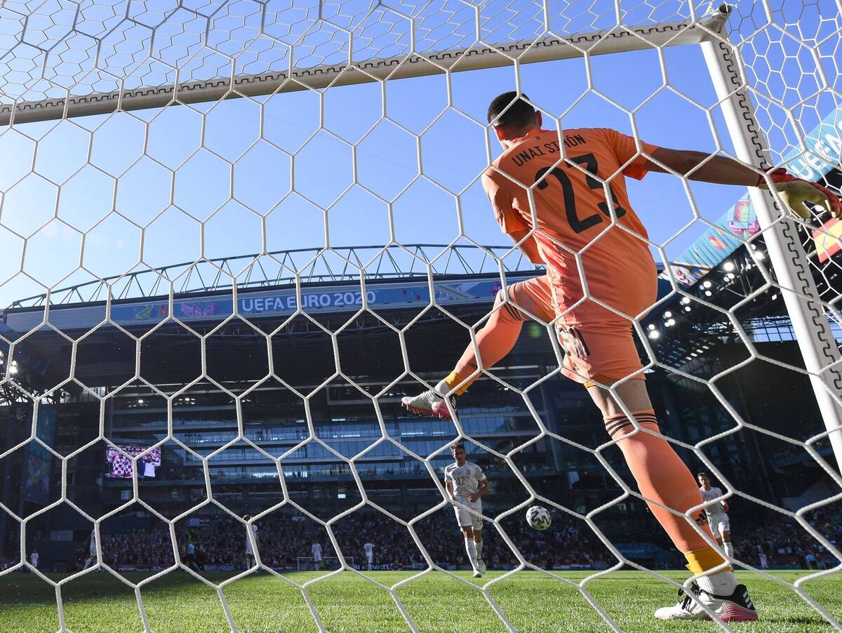 Spain's goalkeeper Unai Simon kicks the ball after scoring an own goal during the round of 16 football match against Croatia. Picture: Jonathan Nackstrand Spain's goalkeeper Unai Simon kicks the ball after scoring an own goal during the round of 16 football match against Croatia. Picture: Jonathan Nackstrand