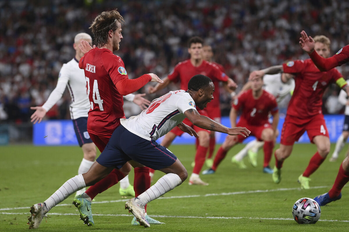 England's Raheem Sterling, left, is fouled by Denmark's Mathias Jensen and a penalty is awarded. Picture: Laurence Griffiths/Pool Photo via AP England's Raheem Sterling, left, is fouled by Denmark's Mathias Jensen and a penalty is awarded. Picture: Laurence Griffiths/Pool Photo via AP