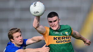 <p>Seán O'Shea of Kerry is tackled by Brian Fox of Tipperary. Picture: Piaras Ó Mídheach/Sportsfile</p>