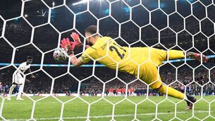 <p>Italy's goalkeeper Gianluigi Donnarumma saves a shot by England's midfielder Bukayo Saka. Picture: Picture: Paul Ellis</p>
