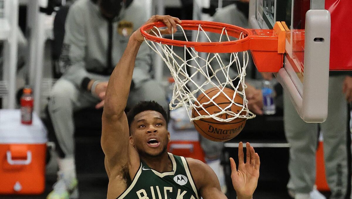 OWN YOU: Antetokounmpo dunks the ball over Jae Crowder and Chris Paul of the Suns in Game 3 of the NBA Finals against the Phoenix Suns at Fiserv Forum in Milwaukee. 