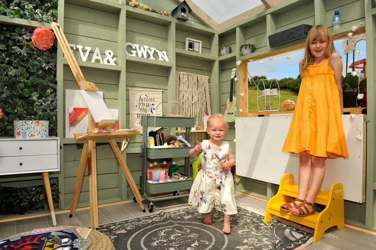 A transparent plastic roof on Gwyn and Eva Reid's garden playhouse ensures plentiful daylight inside the wooden structure. A transparent plastic roof on Gwyn and Eva Reid's garden playhouse ensures plentiful daylight inside the wooden structure.