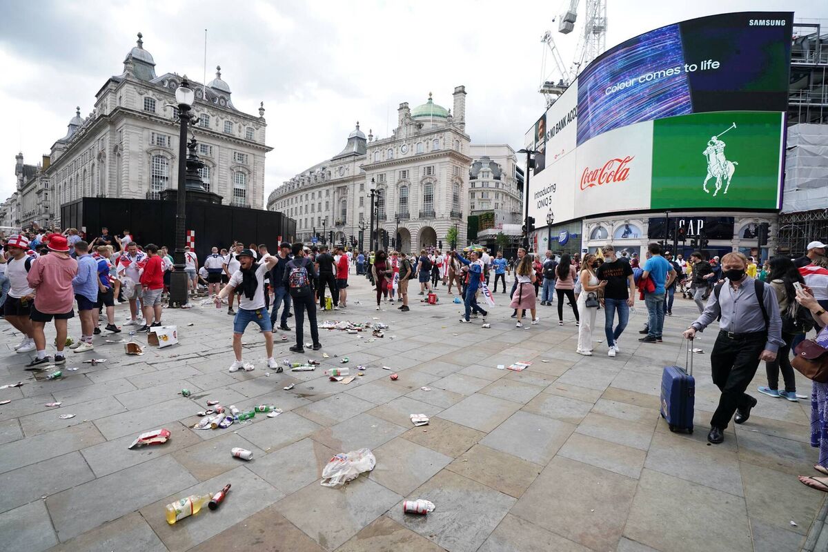Partying England fans leave rubbish at Piccadilly Circus, central London. Picture: PA Partying England fans leave rubbish at Piccadilly Circus, central London. Picture: PA