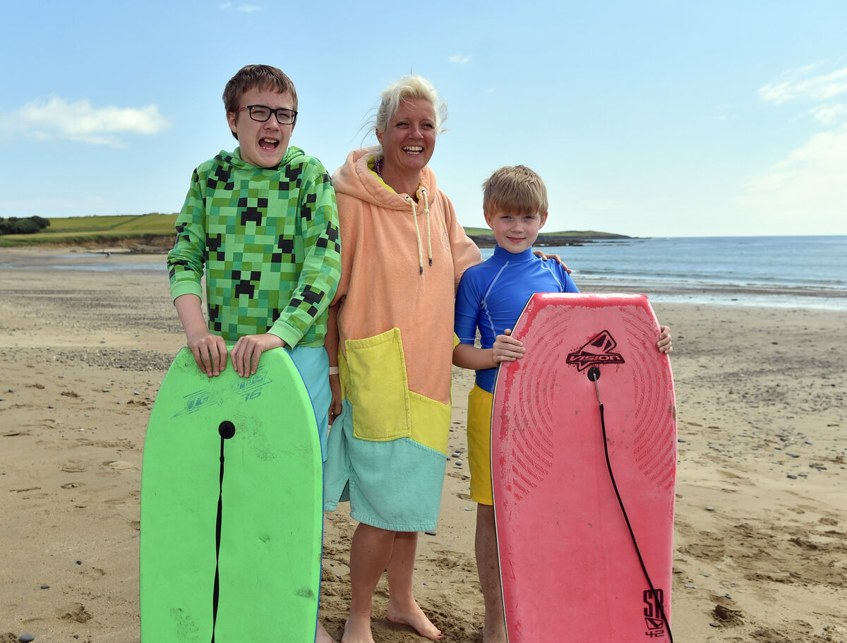 Maxine Acton with her sons Bobby and Elliot: 'This beach is our favourite, it’s very safe and we can park the campervan right by the beach so the boys can get down without having to cross the road.' Picture: Eddie O'Hare