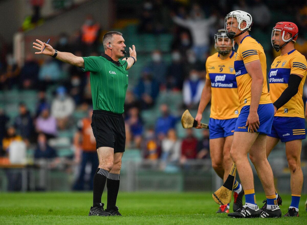 Cathal Malone, Conor Cleary, and John Conlon of Clare look on as referee James Owens awards a penalty to Tipperary. Photo by Ray McManus/Sportsfile