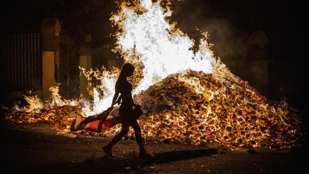 Tiger's Bay 'Eleventh Night' bonfire in Belfast alight in the early hours of Monday morning. Picture: Liam McBurney/PA Wire