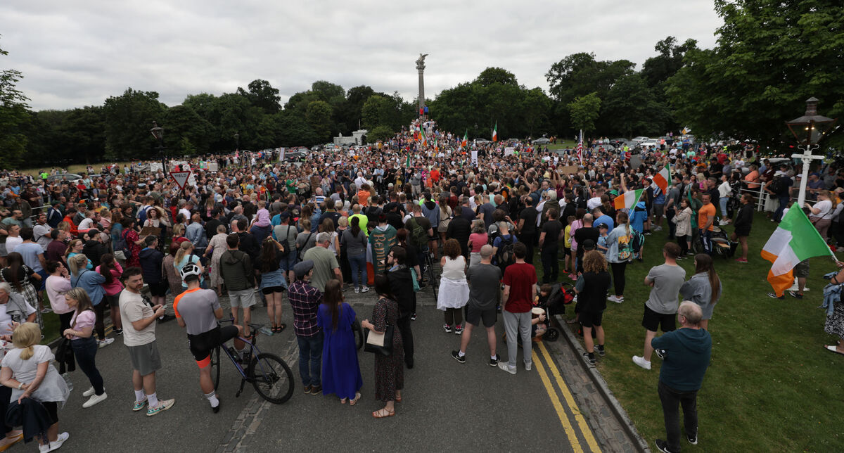 Members of the public attending a protest against vaccine Passports outside Aras an Uachtarain in Phoenix Park last night. Picture: Collins