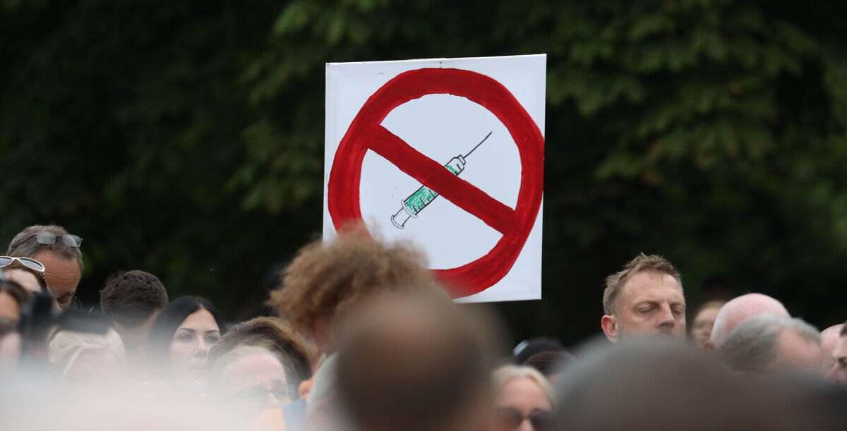Members of the public attending a protest against vaccine Passports outside Aras an Uachtarain in Phoenix Park last night. Picture: Collins