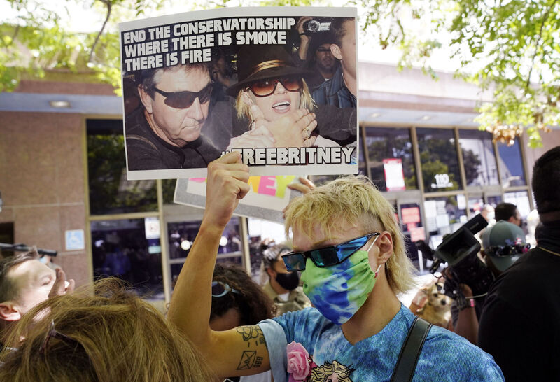 Britney Spears supporter Biblegirl holds a sign outside a court hearing concerning the pop singer's conservatorship at the Stanley Mosk Courthouse, Wednesday, June 23, 2021, in Los Angeles. Picture: AP Photo/Chris Pizzello