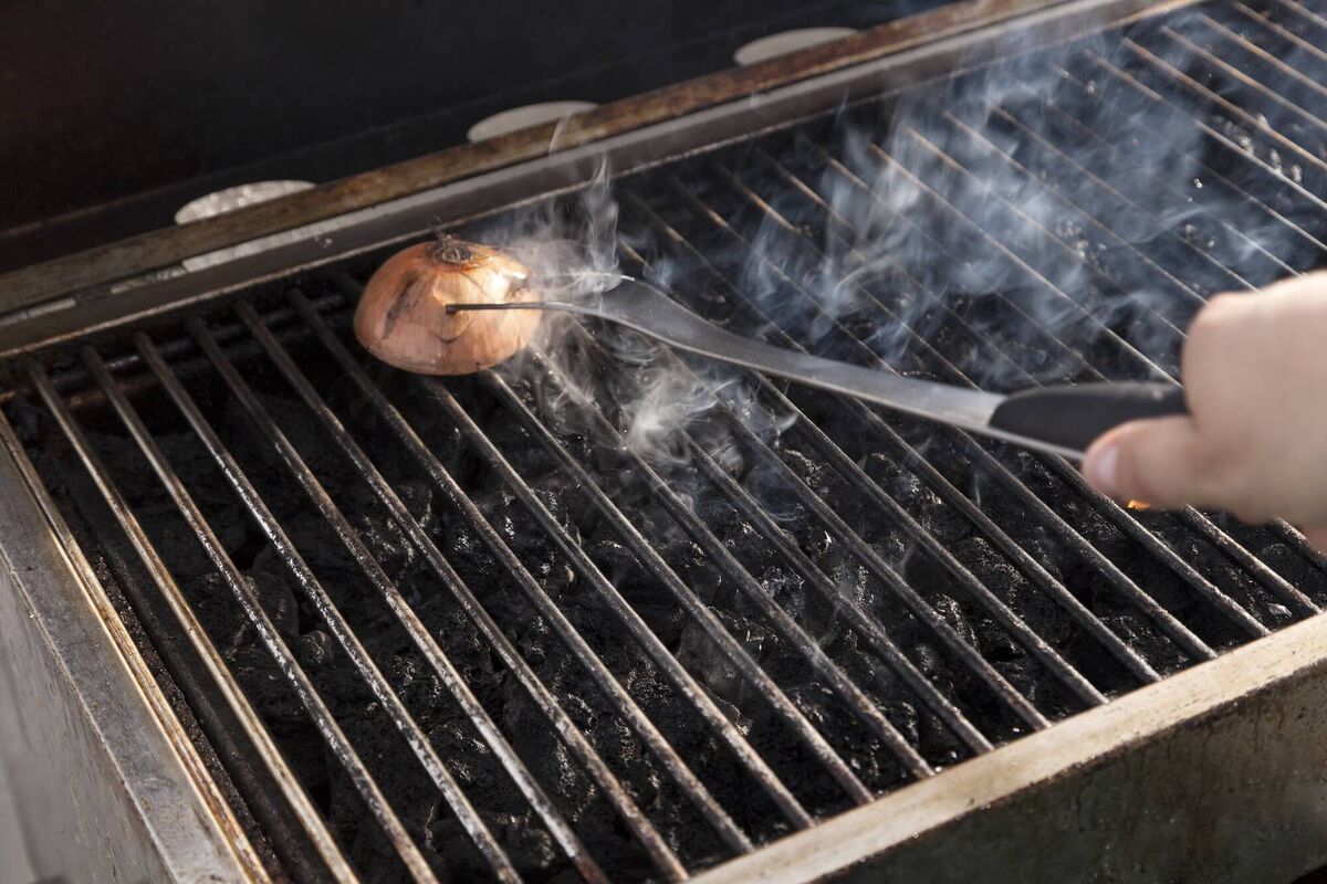 The water in onions makes them great for steam cleaning the grill. Picture: iStock. The water in onions makes them great for steam cleaning the grill. Picture: iStock.