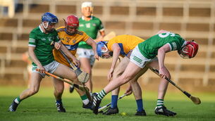 <p>Limerick players Bryan Nix, left, and Donnacha O'Dalaigh contest for possession against Clare's Mike Gough, left, and Adam Mungovan at LIT Gaelic Grounds. Photo by Ben McShane/Sportsfile</p>