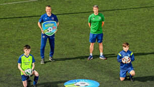 <p>Pictured, from left, Matthew McCarthy, aged 14, from Carrigdine, Republic of Ireland Under-21 Manager Jim Crawford, FAI Football For All Development Officer for Munster Nick Harrison and David Wall, aged 15, from Wilton, during Football For All INTERsport Elverys Summer Soccer School at Carrigaline United AFC, Carrigaline in Cork. Picture: Harry Murphy/Sportsfile</p>