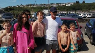 <p>Roy Keane happily posed for pictures with a group of children who were enjoying the glorious sunshine in Youghal.</p>