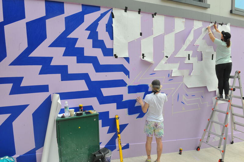 Deirdre Breen and Jamie Howard decorating the ground floor exterior with a mural/artwork. Pic: Larry Cummins. Deirdre Breen and Jamie Howard decorating the ground floor exterior with a mural/artwork. Pic: Larry Cummins.