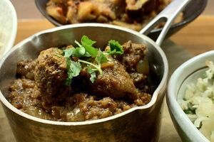 Lamb bhuna with pilaf rice and onion relish
