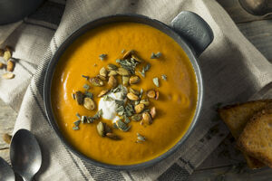 Butternut soup with wild garlic oil and toasted seeds
