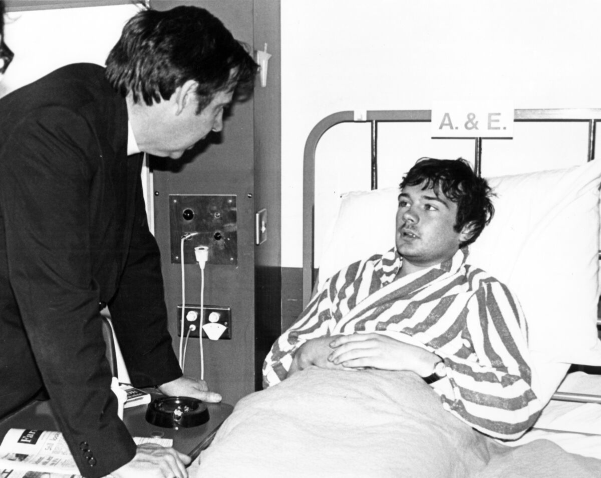 Bishop Poyntz speaks with one of the survivors of the rail crash in hospital