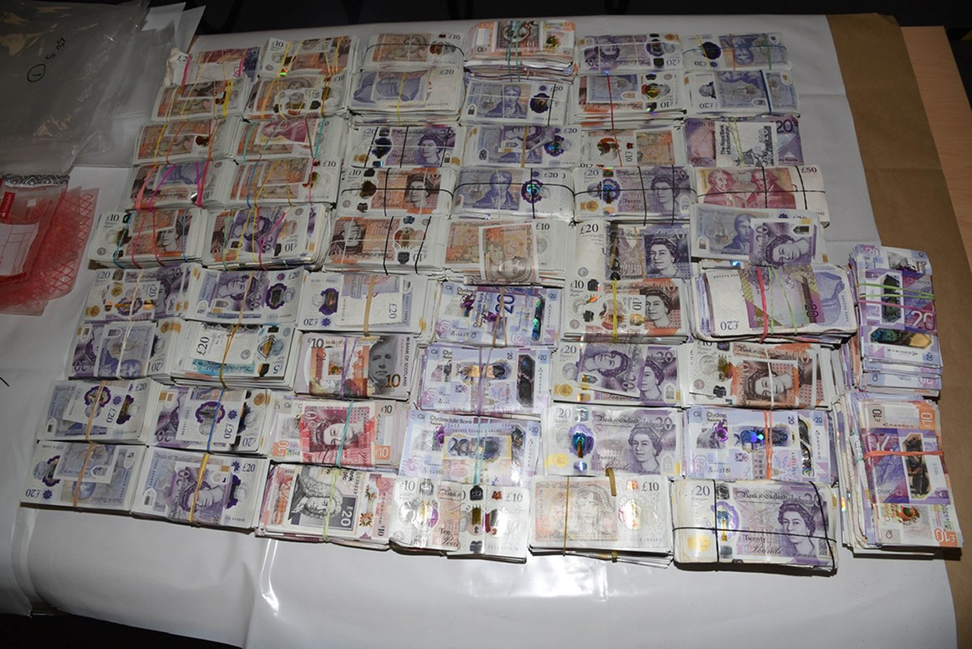 Jail for woman stopped at Heathrow with five suitcases containing over £1.9m in cash