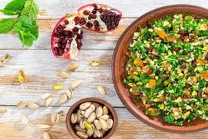 Tabouleh with pomegranate seeds and apple
