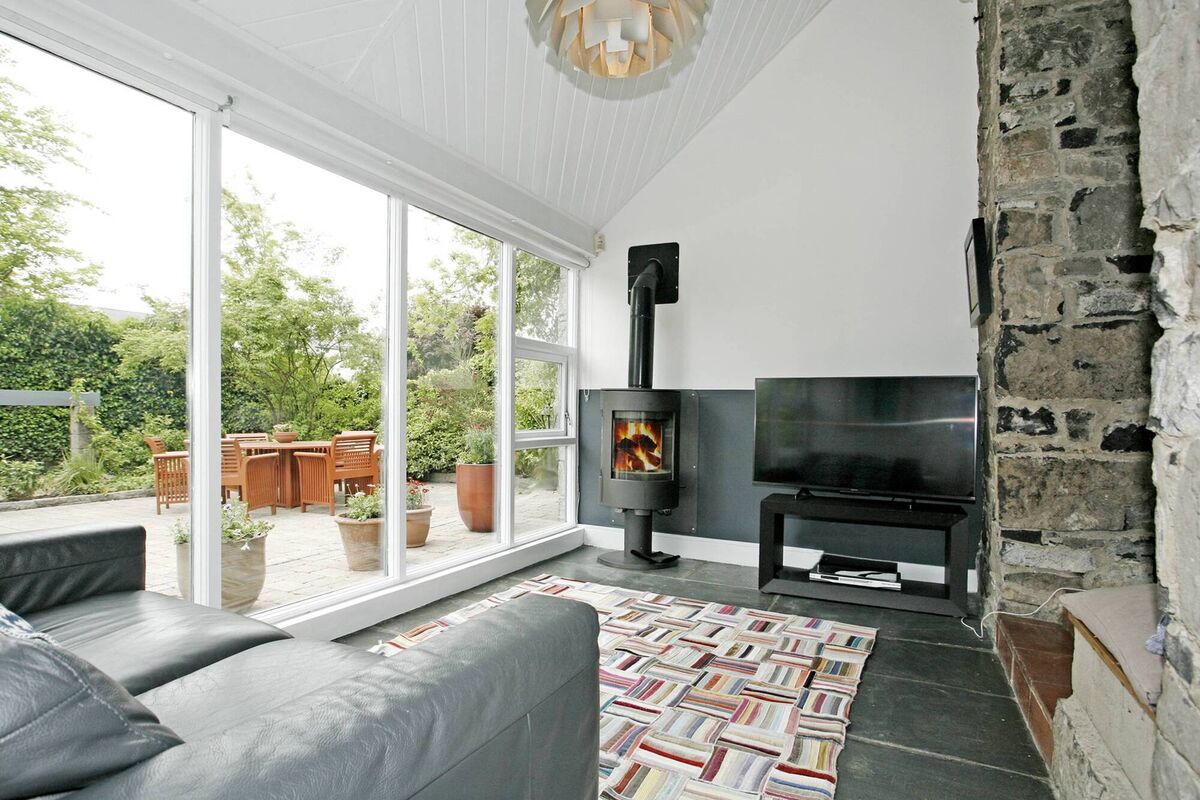 TV room with garden views