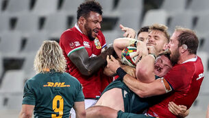 <p>South Africa's Jasper Wiese is tackled by Courtney Lawes, Chris Harris, and Alun Wyn Jones of the British &amp; Irish Lions. Picture: INPHO/Dan Sheridan</p>