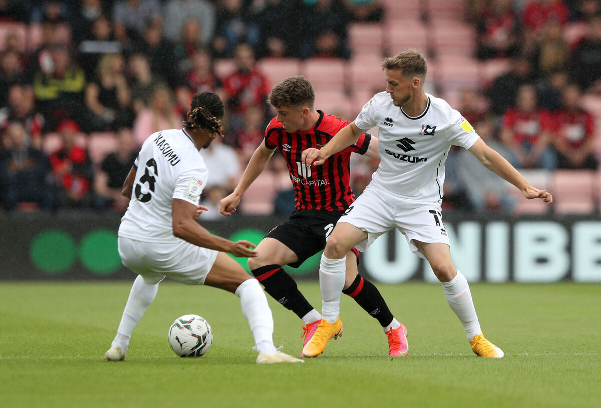 AFC Bournemouth's Gavin Kilkenny battle for the ball and Milton Keynes Dons' David Kasumu (left) and Charlie Brown during the Carabao Cup first round match at the Vitality Stadium, last weekend. Picture: Kieran Cleeves