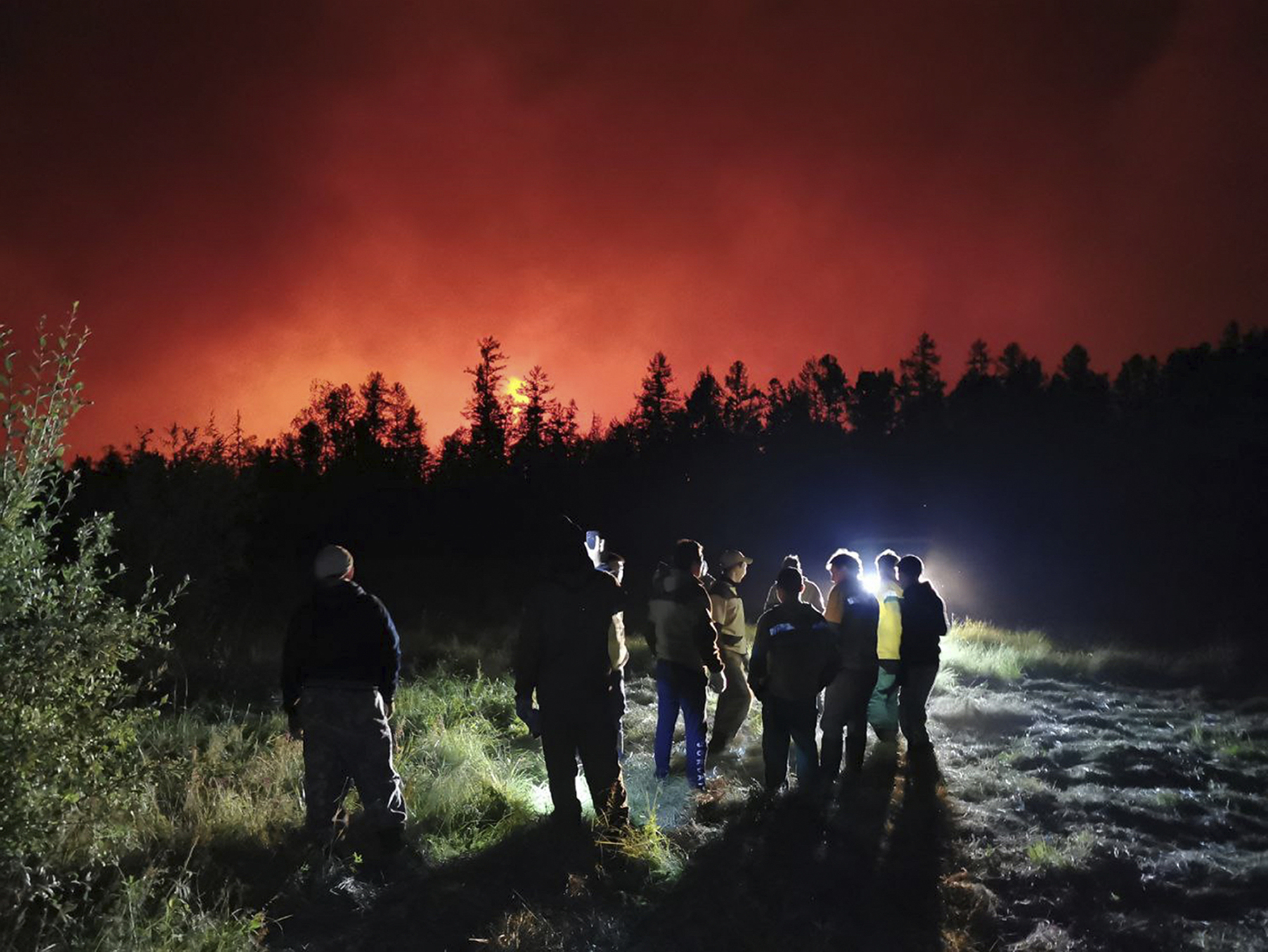 Wildfires endanger villages and fuel site in Russia’s Siberia