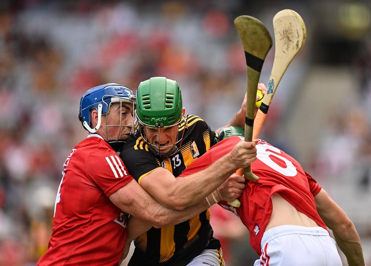 Eoin Cody of Kilkenny in action against Seán O'Donoghue and Mark Coleman of Cork. Picture: Harry Murphy/Sportsfile