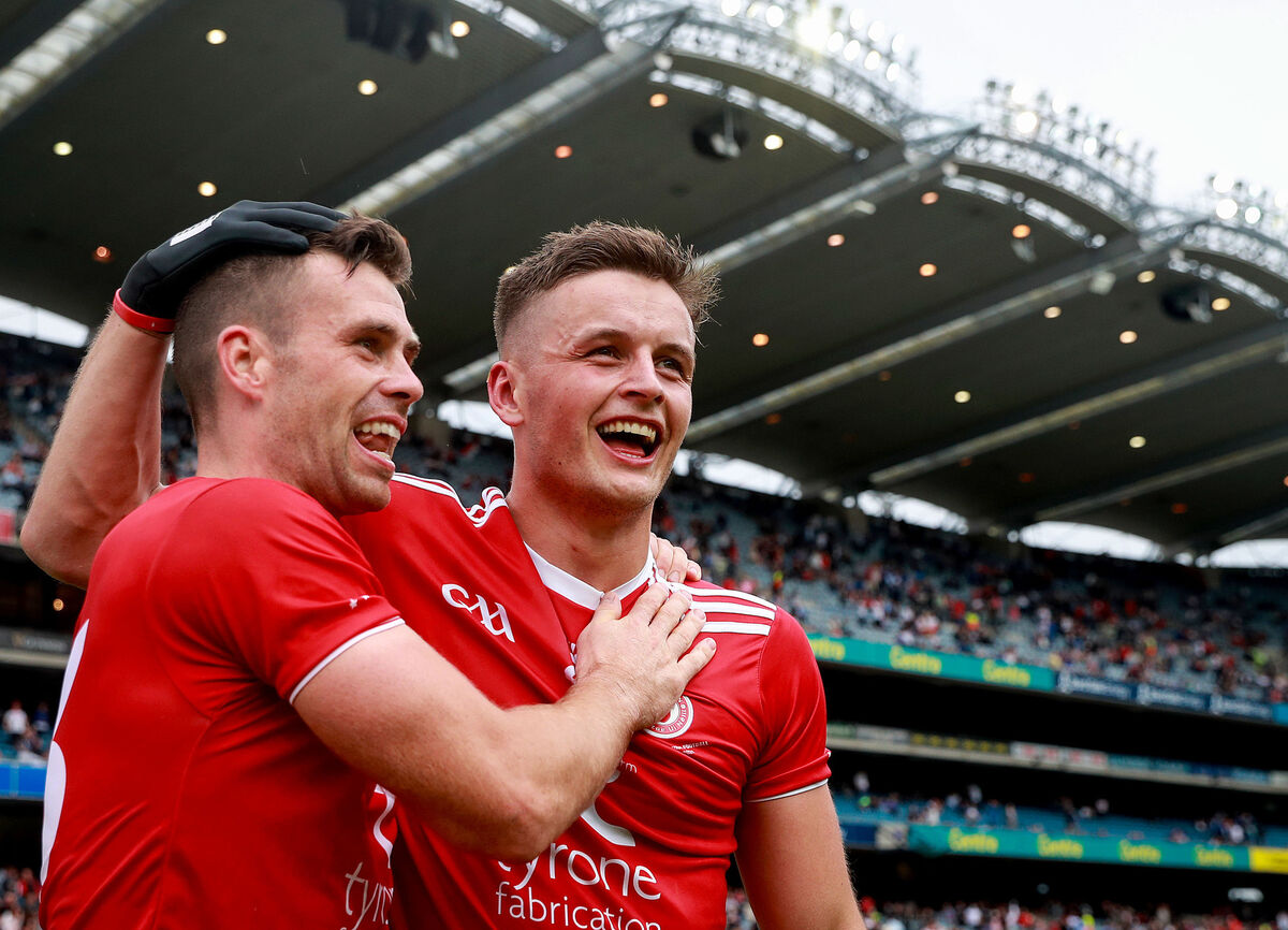 Tyrone’s Darren McCurry celebrates after the Ulster SFC win with Michael McKernan. Picture: INPHO/Tommy Dickson