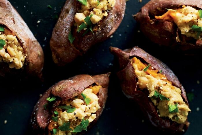 Baked sweet potatoes with omega houmous