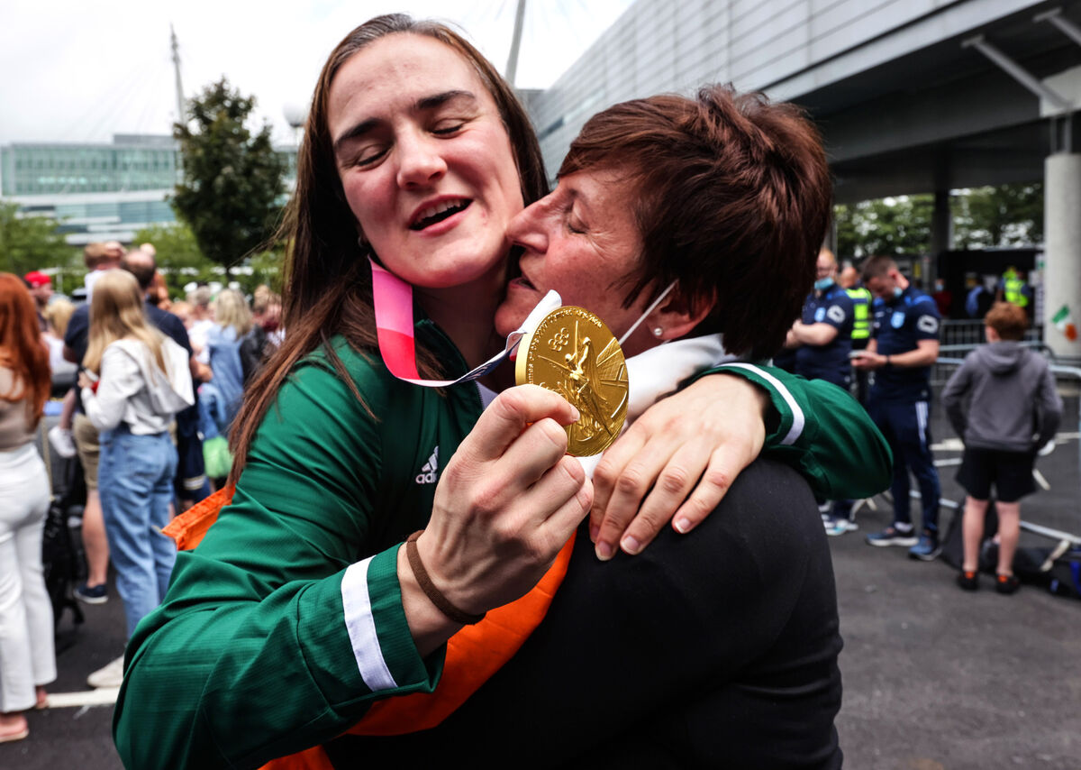 Kellie Harrington is greeted by friends and family after returning to Dublin with her gold medal. Picture: ©INPHO/Laszlo Geczo Kellie Harrington is greeted by friends and family after returning to Dublin with her gold medal. Picture: ©INPHO/Laszlo Geczo