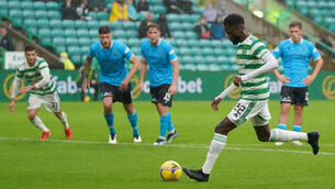 <p>Celtic's Odsonne Edouard scores a penalty, and his side's sixth goal of the game, against Dundee. Picture: Jane Barlow/PA</p>
