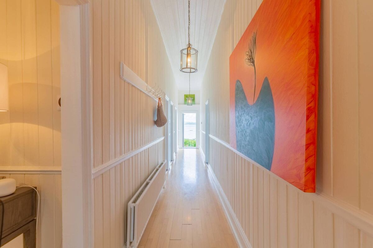 Original c 120-year old timber panelling  is much in evidence, including in the hall